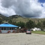 Kettle River RV Park office, parking area and mountain views